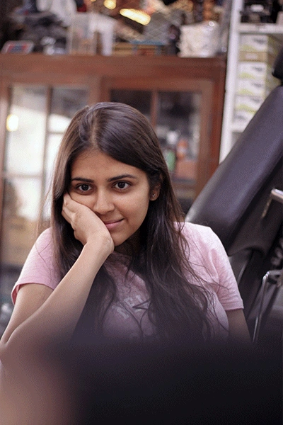 A Girl SMiling while making Tattoo kraayonz