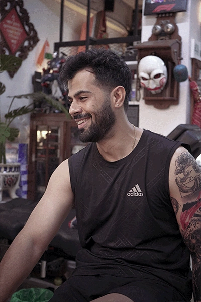 a man making tattoo on his hand