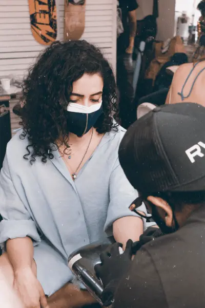 Girl is creating Tattoo